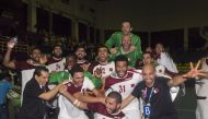 Jubilant Qatar handball players and officials celebrate after winning the gold medal, defeating Bahrain in the final.