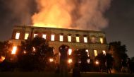 People watch as a fire burns at the National Museum of Brazil in Rio de Janeiro, Brazil September 2, 2018. REUTERS/Ricardo Moraes 