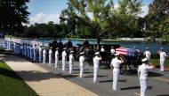In this photo released by the McCain Family, the horse-drawn caisson bearing the body of Senator John McCain (R-AZ) moves through the grounds of the United Sates Naval Academy toward the cemetery after a service in the Chapel on September 2, 2018, in Anna