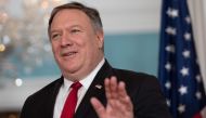 (FILES) In this file photo taken on August 21, 2018 US Secretary of State Mike Pompeo waves to the media during a photo opportunity prior to his meetings with Macedonian Minister of Foreign Affairs Nikola Dimitrov at the State Department in Washington, DC