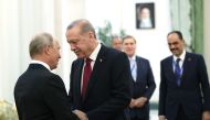 Russia's President Vladimir Putin (L) shaking hands with his Turkey's counterpart Recep Tayyip Erdogan during their meeting in Tehran on September 7, 2018. -  AFP PHOTO /Turkish Presidential Press Office 