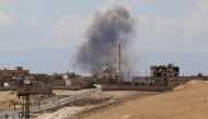 Smoke billows following Syrian government forces' bombardment around the town of Khan Sheikhun on the southern edges of the rebel-held Idlib province on September 8, 2018. AFP / OMAR HAJ KADOUR