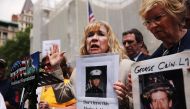 (FILES) In this file photo taken on May 26, 2014, Sally Regenhard, who lost her son on 9/11, speaks at a news conference with other family members on the steps of City Hall to criticize the placement of unidentified human remains beneath the newly opened 