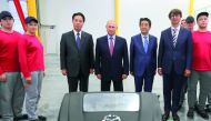 Representative Director and Chairman of the Board at Mazda Motor Corporation Masamichi Kogai (3rd L), Russia's President Vladimir Putin (4th L), Japan's Prime Minister Shinzo Abe (3rd R), Sollers Director General Vadim Shvetsov (2nd R) and workers pose fo