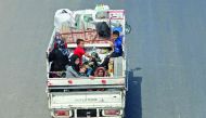 Residents of the Idlib province flee toward the Syrian Turkish border on September 10, 2018. AFP / Omar Haj Kadour  