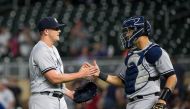 New York Yankees relief pitcher Jonathan Holder (56) and catcher Gary Sanchez (24) celebrate after the game against Minnesota Twins at Target Field. Brad Rempel-USA TODAY Sports
