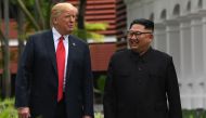 In this file photo taken on June 11, 2018 North Korea's leader Kim Jong Un (R) walks with US President Donald Trump (L) during a break in talks at their historic US-North Korea summit, at the Capella Hotel on Sentosa island in Singapore.  / AFP / SAUL LOE