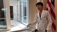 Jennie Jin, a forensic anthropologist who leads the Korea War Project at the Defense POW/MIA Accounting Agency (DPAA), shows some of the objects that accompanied the human remains handed over by North Korea, including a wallet, buttons and canteens, at Jo