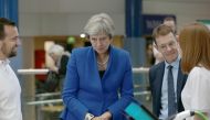 Britain's Prime Minister Theresa May (C) greets participants at the Zero Emission Vehicle Summit in Birmingham, central England on September 11, 2018. / AFP / POOL / Aaron Chown
