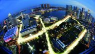 he Marina Bay street circuit is illuminated at dusk in Singapore September 17, 2013. The Singapore Formula One Grand Prix night race will take place on September 22, 2013. Picture taken with a fish-eye lens. Reuters/Edgar Su