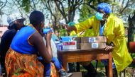 A nurse takes care of cholera patients during an action, organised by Zimbabwe Minister of Health, at the cholera treatment centre of the Beatrice Infectious Diseases Hospital, in Harare, on September 11, 2018.  AFP / Jekesai Njikizana 