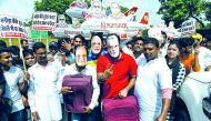 Activists and supporters of the Indian Youth Congress wear masks bearing images of Finance Minister Arun Jaitley (L), businessman Vijay Mallya and Prime Minister Narendra Modi (C) as they protest against the Bharatiya Janata Party (BJP) for allegedly allo