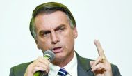 In this file photo taken on June 06, 2018 Jair Bolsonaro, presidential candidate for the Social Liberal Party, attends an interview for Correio Brazilianse newspaper in Brasilia. AFP / Evaristo Sa

