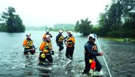 Members of the FEMA Urban Search and Rescue Task Force 4 from Oakland, California, search a flooded neighborhood for evacuees during Hurricane Florence September 14, 2018 in Fairfield Harbour, North Carolina. Chip Somodevilla/Getty Images/AFP 