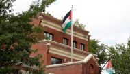 Flags fly over the Palestine Liberation Organization (PLO) office two days after President Donald Trump's national security adviser John Bolton announced that the State Department would close the PLO office in Washington, September 12, 2018. Reuters/Kevin