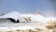 This CNA handout picture taken on September 15, 2018 shows giant large waves hitting the coast of Taitung county, eastern Taiwan, as typhoon Mangkhut approaches the southern Taiwan.  Macau OUT / AFP / CNA / CNA PHOTO 