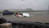 A pickup truck is seen submerged in floodwater in Lumberton, North Carolina, on September 15, 2018 in the wake of Hurricane Florence.  / AFP / Alex Edelman 