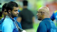 Sri Lankan coach Chandika Hathurusingha (R) talks with Bangladesh's Tamim Iqbal at the end of the one day international (ODI) Asia Cup cricket match between Bangladesh and Sri Lanka at The Dubai International Cricket Stadium on September 15, 2018. AFP / I