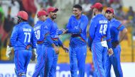 Afghan cricketer Mujeeb Ur Rahman (C) celebrates with his teammates after he dismissed Sri Lankan batsman Dasun Shanaka during the one day international (ODI) Asia Cup cricket match between Sri Lanka and Afghanistan at the Sheikh Zayed Stadium in Abu Dhab
