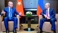Russian President Vladimir Putin (R) talks to Turkish President Recep Tayyip Erdogan during their meeting in the Bocharov Ruchei residence in the Black Sea resort of Sochi in Sochi on September 17, 2018. AFP / Alexander Zemlianichenko