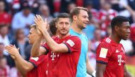 Bayern Munich's Robert Lewandowski applauds fans after the match REUTERS/Michael Dalder 