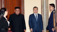 South Korean President Moon Jae-in (2nd R) and North Korean leader Kim Jong Un (2nd L) arrive at a room to attend a signing ceremony after their summit at Paekhwawon State Guesthouse in Pyongyang on September 19, 2018. AFP PHOTO / Pyeongyang Press Corps
