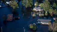 Homes are surrounded by floodwaters from Hurricane Florence on September 17, 2018 in Conway, South Carolina. Sean Rayford/Getty Images/AFP