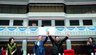 South Korean President Moon Jae-in and North Korean leader Kim Jong Un acknowledges the audience after watching the performance titled 