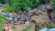 Rescuers continue their search for missing miners in a landslide caused by Typhoon Mangkhut at a small-scale mining camp in Itogon, Benguet, in the Philippines, September 19, 2018. REUTERS/Harlington Palangchao 