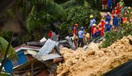 Rescuers search for survivors at the landslide site in Naga City, on the popular tourist island of Cebu on September 20, 2018. AFP / ALAN TANGCAWAN
 