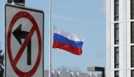 In this file photo taken on March 26, 2018, the Russian Federation flag flies in front of its embassy in Washington, DC.  / AFP / GETTY IMAGES NORTH AMERICA / CHIP SOMODEVILLA 