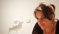 British artist Tracey Emin poses with her artwork 