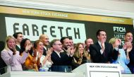 Online fashion house Farfetch's CEO Jose Neves and members of the company's leadership team ring the opening bell to celebrate their IPO at the New York Stock Exchange (NYSE) in New York, U.S., September 21, 2018. Reuters/Brendan McDermid