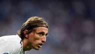 Real Madrid's Croatian midfielder Luka Modric looks on during the UEFA Champions League group G football match between Real Madrid CF and AS Roma at the Santiago Bernabeu stadium in Madrid on September 19, 2018. / AFP / GABRIEL BOUYS