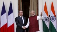 FILE PHOTO: French President Francois Hollande (L) shakes hands with India's Prime Minister Narendra Modi during a photo opportunity ahead of their meeting at Hyderabad House in New Delhi, India, January 25, 2016. REUTERS/Adnan Abidi
