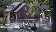  People navigate floodwaters caused by Hurricane Florence near the Waccamaw River on September 23, 2018 in Conway, South Carolina. Floodwaters are expected to continue to rise in Conway over the next two days. Sean Rayford/Getty Images/AFP