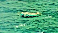 The capsized yacht Thuriya of solo sailor Abhilash Tomy is pictured at sea in this September 24, 2018 handout photo by the Indian Navy. Indian Navy 
