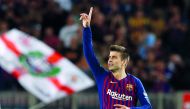 Barcelona's Gerard Pique celebrates scoring their second goal. Reuters/Albert Gea