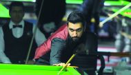 A Qatari player in action in the Asian 6Reds Championship at the Qatar Billiards and Snooker Federation hall in Doha yesterday.