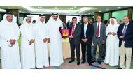 Qatar Chamber Vice-Chairman Mohamed bin Ahmed bin Towar Al Kuwari (fourth left) with Triviyan K Kalra (centre), CEO of K-flex India Co; P Kumaran (fourth right), Ambassador of India to Qatar, and other Qatar Chamber and Indian officials.