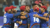 Afghan cricketer Rashid Khan (C), captain Asghar Afghan (R) celebrates with teammate after Match tied during the one day international (ODI) Asia Cup cricket match between Afghanistan and India at the Dubai International Cricket Stadium in Dubai on Septem
