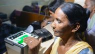 This photo taken on July 17, 2018 shows an Indian woman getting her fingerprints read during the registration process for Aadhaar cards (or unique identifier [UID] cards) in Amritsar. AFP / NARINDER NANU