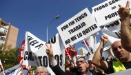 Drivers from shared-ride services Uber and Cabify attend a demonstration in Madrid as part of a strike to protest a law that aims to regulate shared-ride services in Madrid, Spain, September 27, 2018. REUTERS/Juan Medina