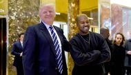 This file photo taken on December 13, 2016 shows US singer Kanye West (R) and then-president-elect Donald Trump speaking with the press after their meetings at Trump Tower in New York. / AFP / TIMOTHY A. CLARY 