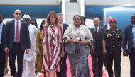 US First Lady Melania Trump walks alongside Rebecca Akufo-Addo, the First Lady of Ghana, during an arrival ceremony after landing at Kotoka International Airport in Accra October 2, 2018 as she begins her week long trip to Africa to promote her 'Be Best' 