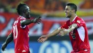 Persepolis’ Ali Alipour (right) celebrates with team-mate Goodwin Mensha after scoring during the AFC Champions League semi-final first leg against Al Sadd at the Jassim Bin Hamad Stadium in Doha, yesterday. 
