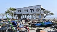 A building stands amid the debris of a flattened fishing village in Lere subdistrict in Palu, Indonesia's Central Sulawesi on October 3, 2018, after an earthquake and tsunami hit the area on September 28. / AFP / ADEK BERRY