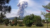 This handout picture taken and released on October 3, 2018 by Indonesia's National Agency for Disaster Management (BNPB) shows Soputan volcano erupting ash up to 4,000 metres above the crater, as seen from Pinabetengan in Southeast Minahasa, North Sulawes