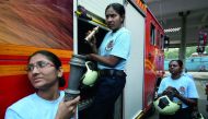 Female firefighters unload the firefighting equipment from a fire engine before a drill at a fire station in Mumbai, India, October 4, 2018. Reuters/Francis Mascarenhas