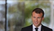 French president Emmanuel Macron attends a ceremony by the grave side of former French statesman General de Gaulle, founder of the Fifth Republic, on the 60th anniversary of the Constitution of the Fifth Republic, on October 4, 2018 in Colombey-les-deux-E